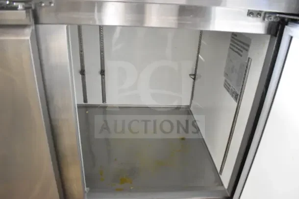 2023 MoTak MPR-93-X Commercial Pizza Prep Table interior view, showing stainless steel construction and adjustable shelving.