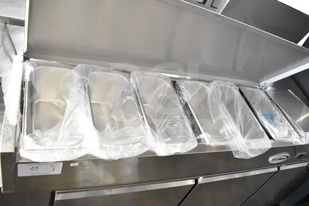 BRAND NEW 2025 KoolMore SCDC-6P-SSL six-pan refrigerated prep station, stainless steel, with scratch and dent labels.