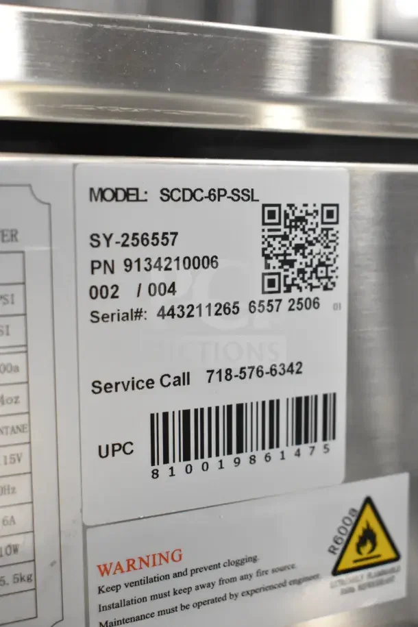 KoolMore SCDC-6P-SSL six pan refrigerated prep station label. Model, serial, and UPC details visible. Brand new.