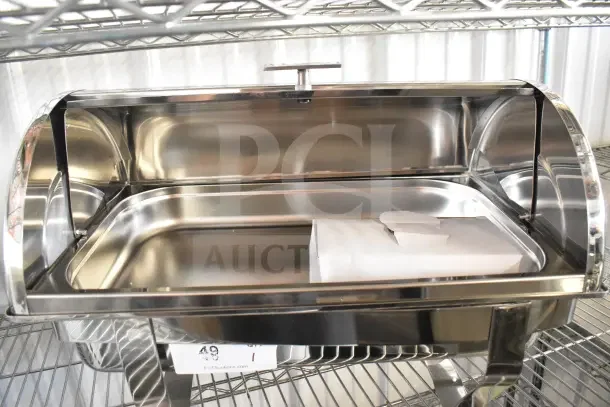 Stainless steel countertop roll top chafing dish, excellent condition, with a roll-top lid and interior food pan.
