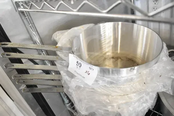 6 Choice 471SAUC55QT 5.5 Qt. Tapered Aluminum Sauce Pans, new scratch and dent, visible auction tag marked "x6".