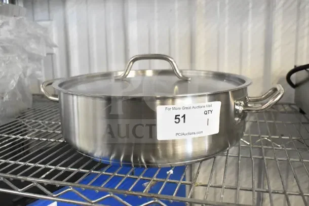Vigor 12 Qt. stainless steel brazier with aluminum-clad bottom and cover, model 473SSBRZR12. Like new condition, auction tag shown.