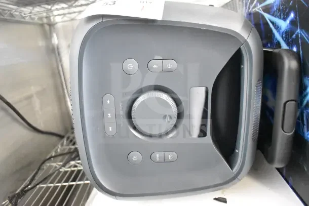 Onn Large Party Speaker store display, top view showing control buttons and volume dial, black, gently used condition.