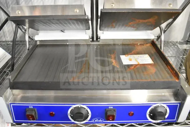Brand new Globe GSGDUE10 Bistro Series double sandwich grill, smooth plates, 20" x 10" surface, some scratches.