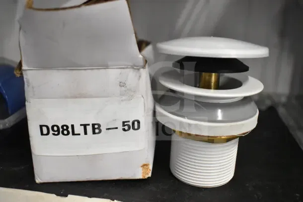 Boxed D98LTB-50 item with white and black components, shown next to packaging, in used condition.