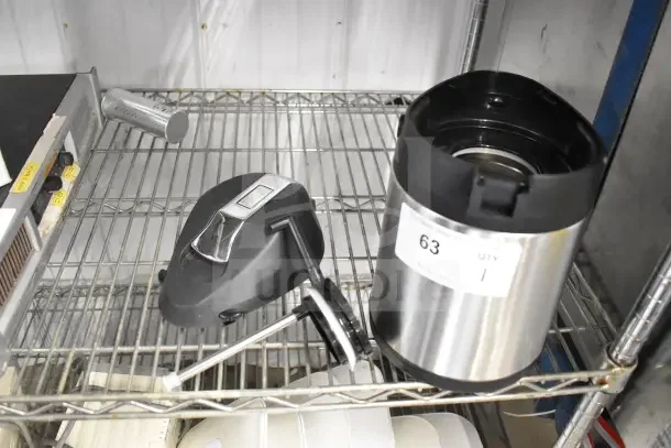 Acopa Air Pot with black lid on metal shelf, includes handle and spout. Appears in good condition. Label marked "63."