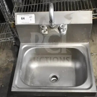 Commercial single bay sink with faucet and handles, stainless steel, fair condition, auction tag numbered 64.