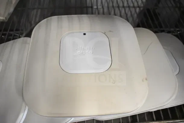 Cisco AIR-CAP3502I-A-K9 dual-band access points, set of 6, visibly used, visible logo, enhances network capacity.