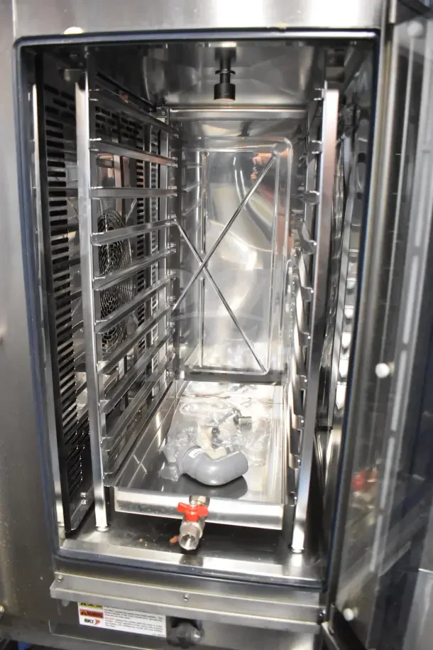 Bakers Pride AETG101R stainless steel commercial combi convection oven, natural gas, equipment stand, interior view.