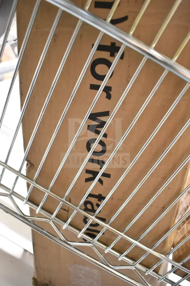 Boxes of BRAND NEW SCRATCH AND DENT 201SS Legs, visible through metal shelving, with marks on packaging.