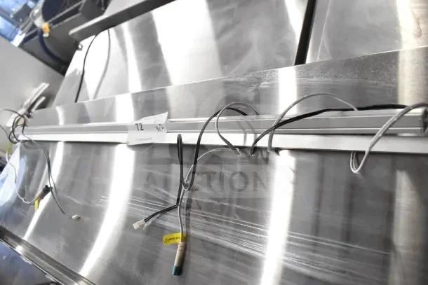 Two fluorescent light fixtures with wiring, marked "72".