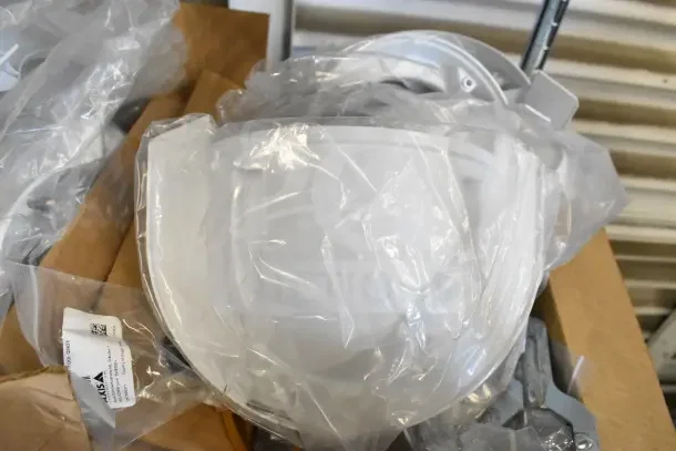 Two boxes of Wren camera mounts in original packaging, new condition. Tags visible with product details.