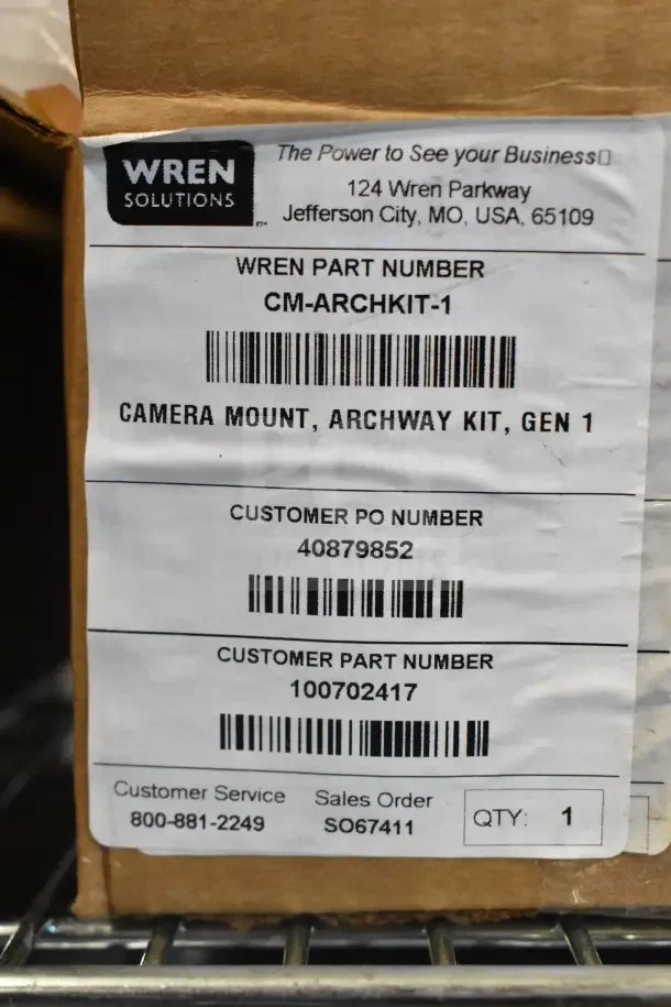 Two boxes of Wren camera mounts, Archway Kit Gen 1, Part CM-ARCHKIT-1, new condition. Includes labels with contact info and part numbers.