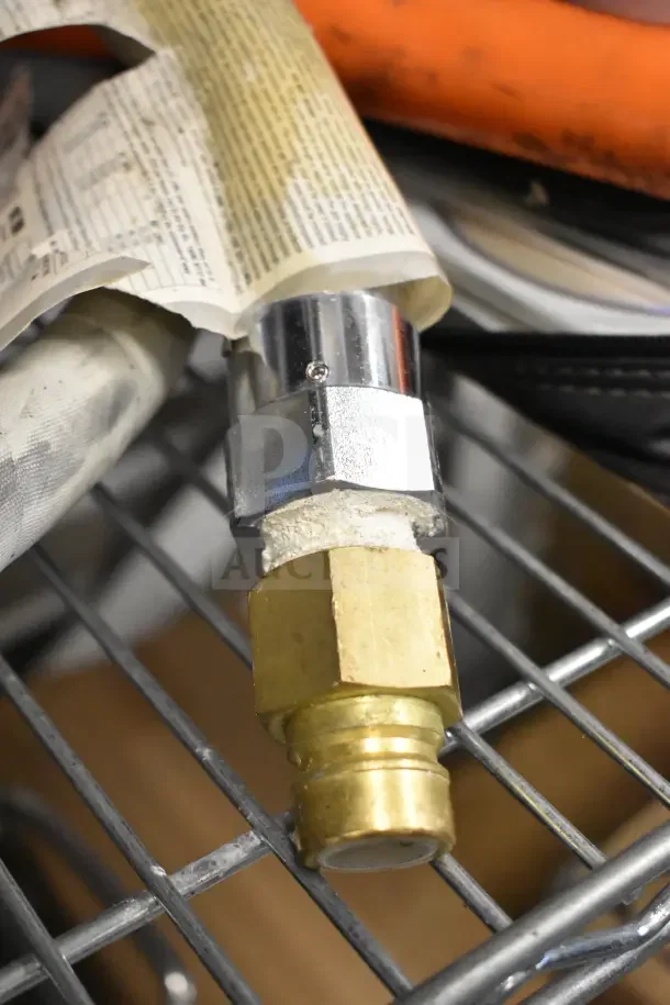 Various hoses with brass fittings, moderate wear, on metal rack; sale includes four hoses for auction bid.