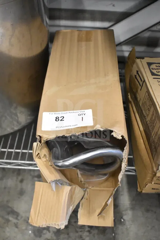 Brand new scratch and dent dough hook in damaged packaging with visible label "82 QTY 1". Ideal for mixers.