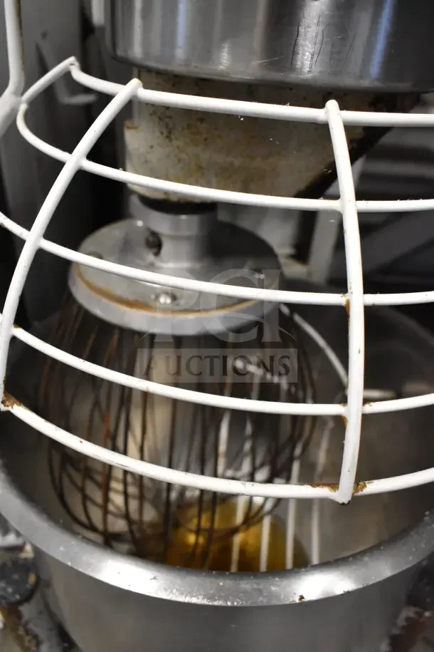 Hobart Medalist floor mixer with bowl, bowl guard, and whisk attachment. Commercial use, 115V, 1 phase. Visible rust on parts.