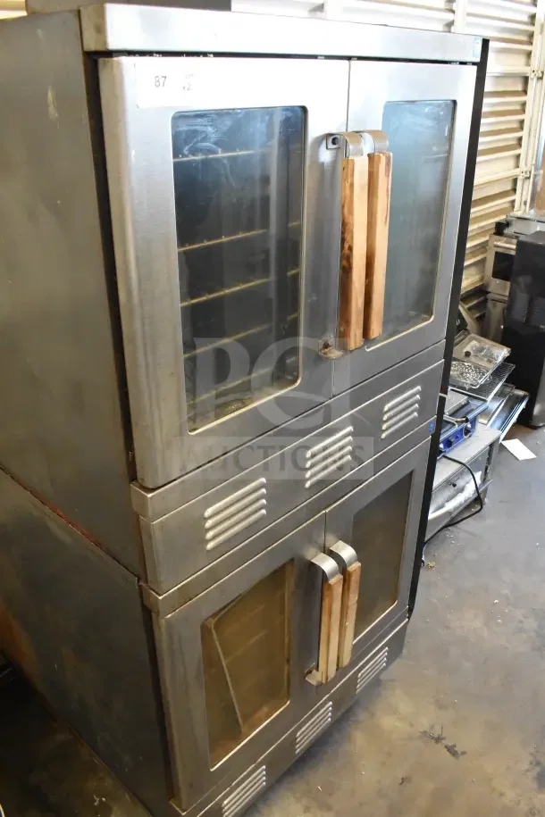 2 Vulcan full-size convection ovens with view-through doors and thermostatic controls. Used, stainless steel finish.