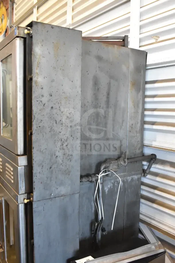 2 Vulcan full-size convection ovens with view-through doors, thermostatic controls, and signs of wear. Steel exterior.