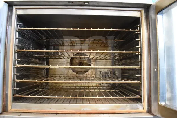 Two Vulcan full-size convection ovens with view-through doors and thermostatic controls, in used condition.