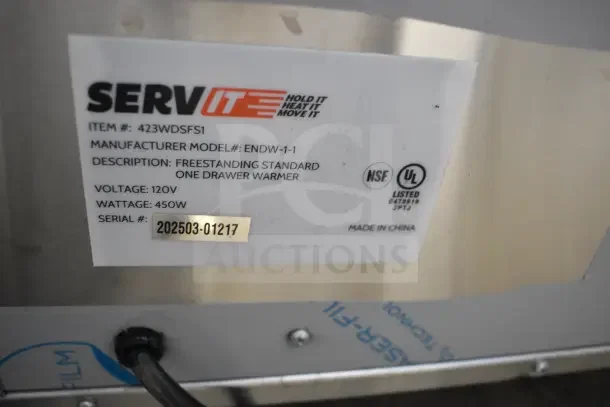 Brand new ServIt 423WDSFS1 single drawer warmer, 120V, with minor scratches and dents. Tag shows model and specs.