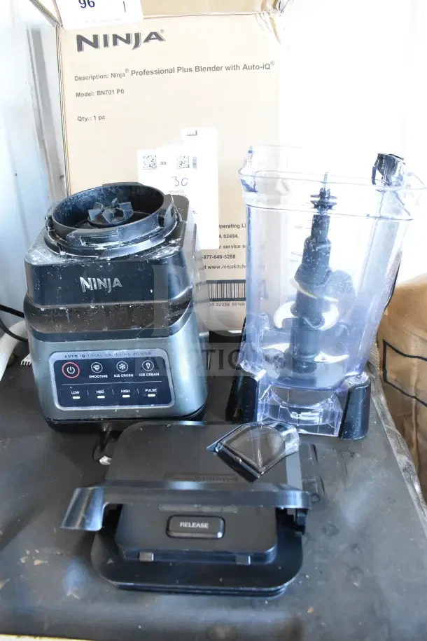 Ninja BN701 Blender with Auto-iQ, includes base, pitcher, lid. Visible wear, original box in background. Model BN701 P0.