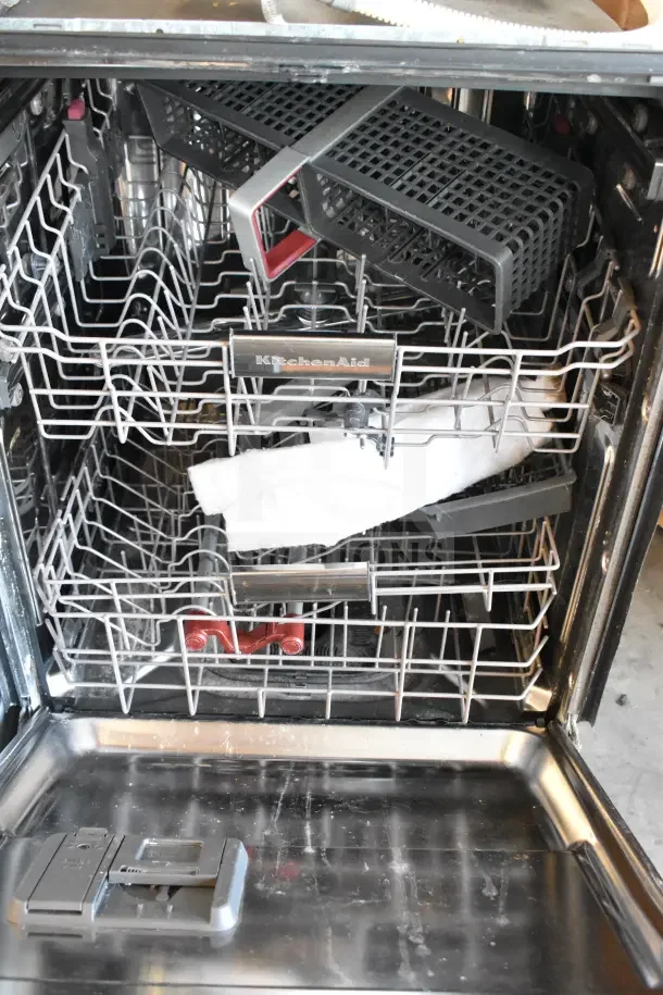 KitchenAid KDTM404KPS undercounter dishwasher, stainless interior, two racks, model and brand markings visible, in good condition.