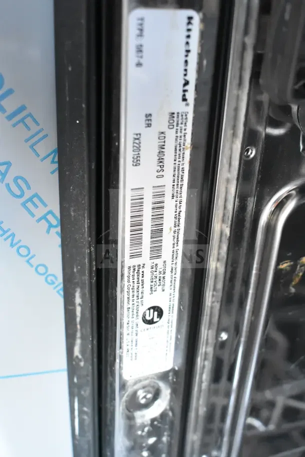 KitchenAid KDTM404KPS undercounter dishwasher label showing model, serial number, voltage specs, and UL certification.
