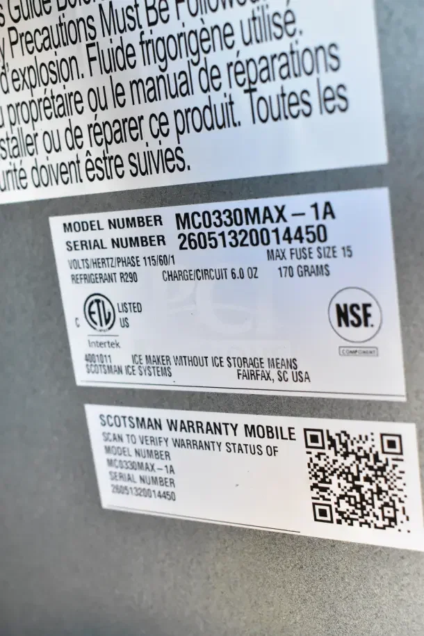 Scotsman MC0330MAX-1A Ice Machine label showing model, serial number, specifications, and warranty QR code.