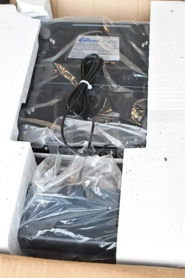 Edlund EPZ Scale in original packaging with power cord, visible brand label, and protective plastic wrap.