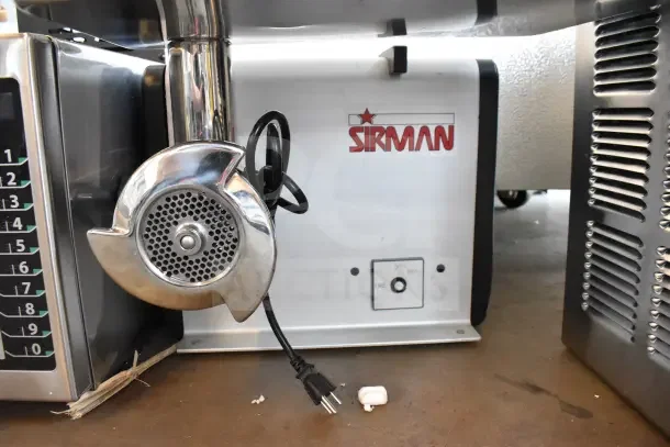 Sirman countertop meat grinder, brand new with minor scratches, 115 volts, 1 phase. Features control panel, plug attached.