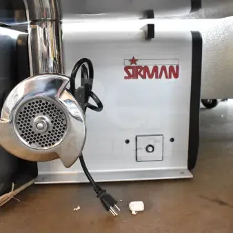 Sirman countertop meat grinder, brand new with minor scratches, 115 volts, 1 phase. Features control panel, plug attached.