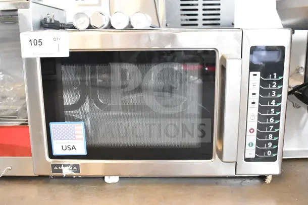 Brand new Amana RCS10TS commercial microwave, scratch and dent, 120 volts, USA-made, with keypad and label showing minor scratches.