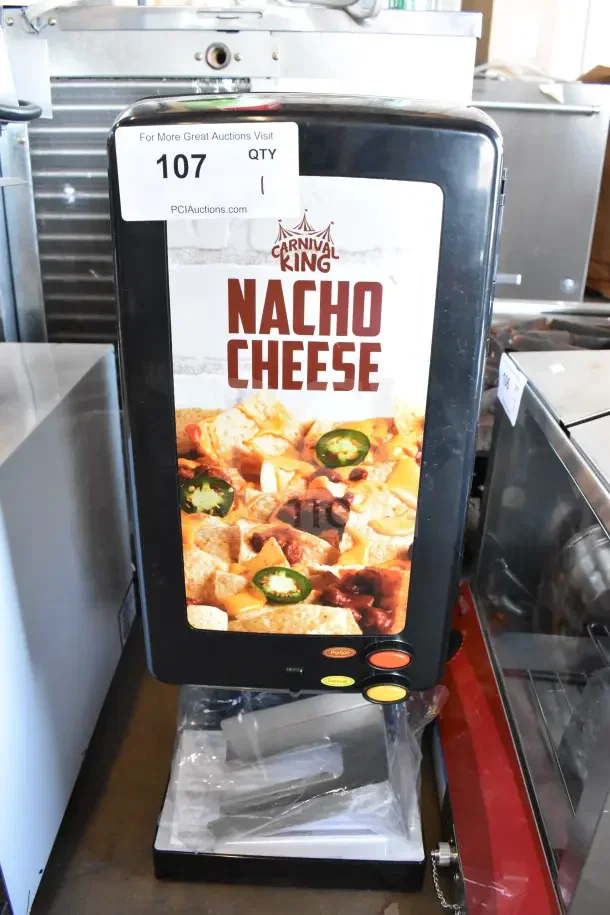 Brand new Carnival King 382CD225 cheese sauce dispenser, 120V, 1 phase, labeled "Nacho Cheese," minor scratches.