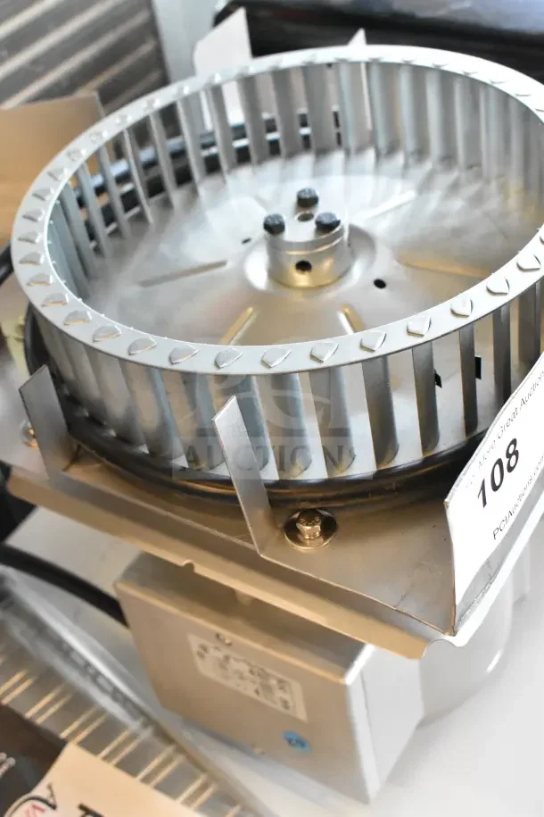 Brand new 2025 Nidec convection oven motor, 115-120 volts, 1 phase, minor scratches, auction tag visible.