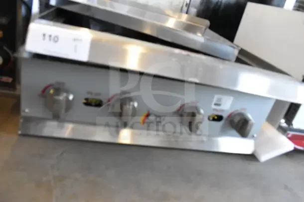 BRAND NEW Cooking Performance Group R-CPG-24-NL 4 Burner Gas Countertop Range, 88,000 BTU, no grates, scratch and dent condition.