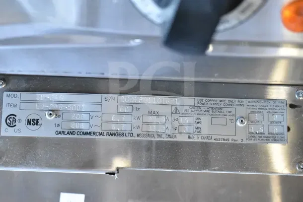 BRAND NEW SCRATCH AND DENT Garland ED-24G 24" Electric Griddle, 208V, 1 Phase, NSF certified, model label showing specs.