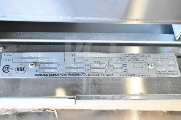 "Garland ED-24G Electric Griddle label showing 208V, 1 Phase specs, CSA and NSF certifications, and serial number 2601391101621."