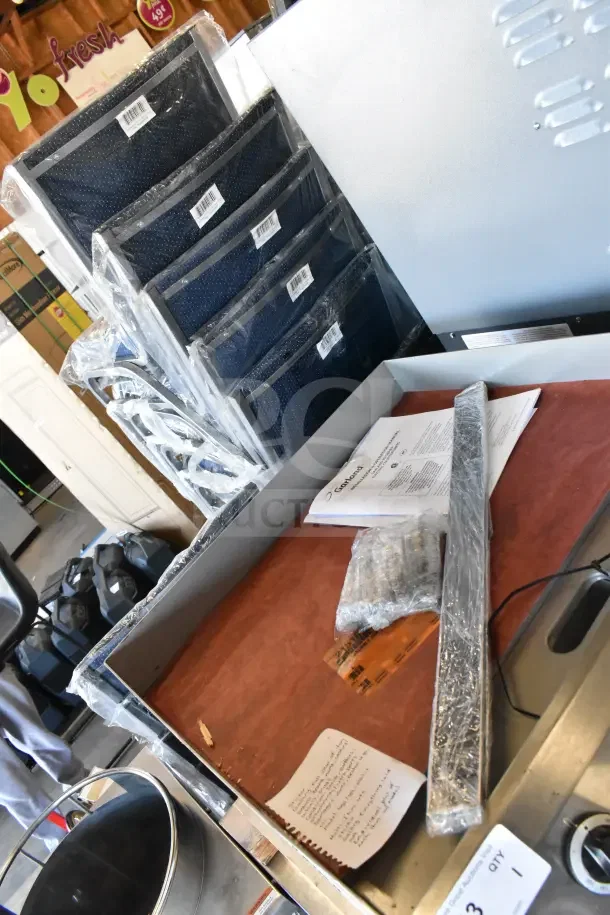 Brand new Garland ED-24G Designer Series 24" electric griddle, 208 volts, 1 phase, minor scratches, includes manuals.