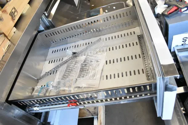 Avantco commercial undercounter cooler, new scratch and dent, 115 volts, 1 phase, features door and 4 drawers, assembly parts visible.