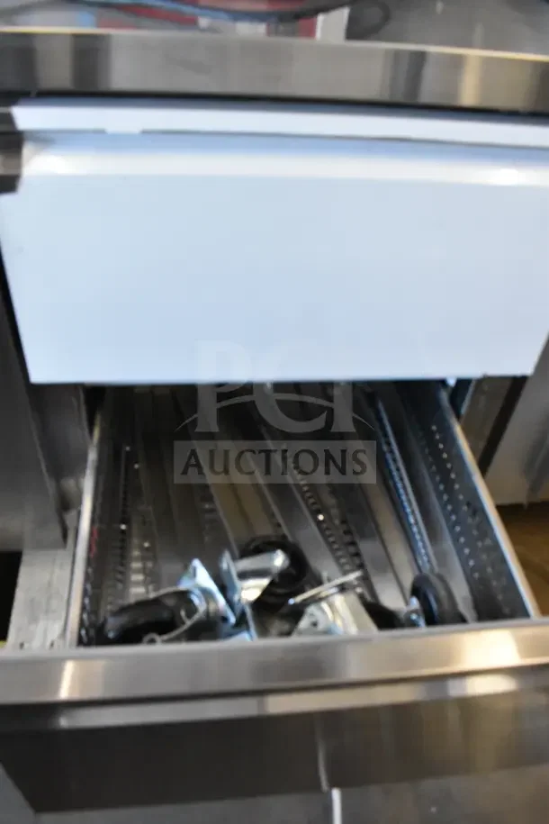 "Avantco commercial undercounter cooler, brand new with minor scratches and dents, features a door and 4 drawers, 115 volts, 1 phase."