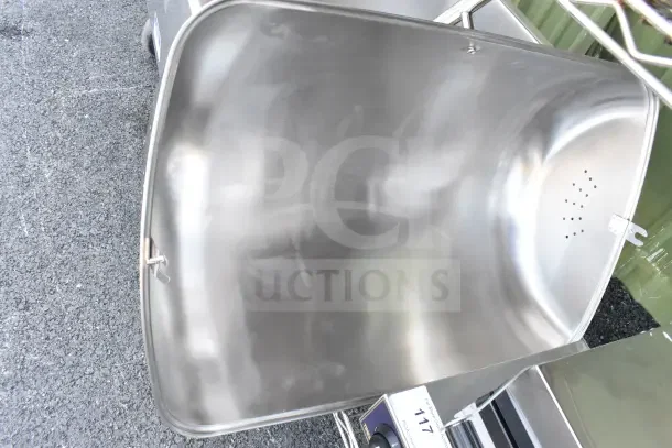 Brand new chafing dish lid with minor scratches and dents, stainless steel, vented design, auction item tag visible.