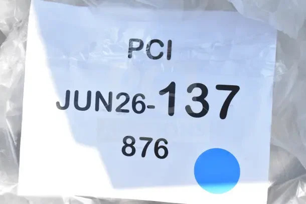 Label on packaging reads "PCI JUN26-137 876" with a blue dot, indicating auction item details.