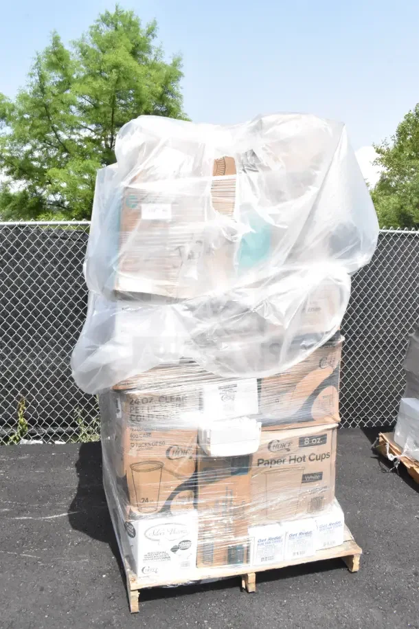 Pallet of 36 scratch and dent items, including plates, cups, bags, and liners, wrapped in plastic.