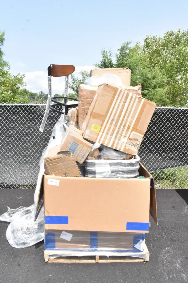 Pallet with 28 new scratch and dent items, including a chair and hole punch. Various boxes, some with labels.