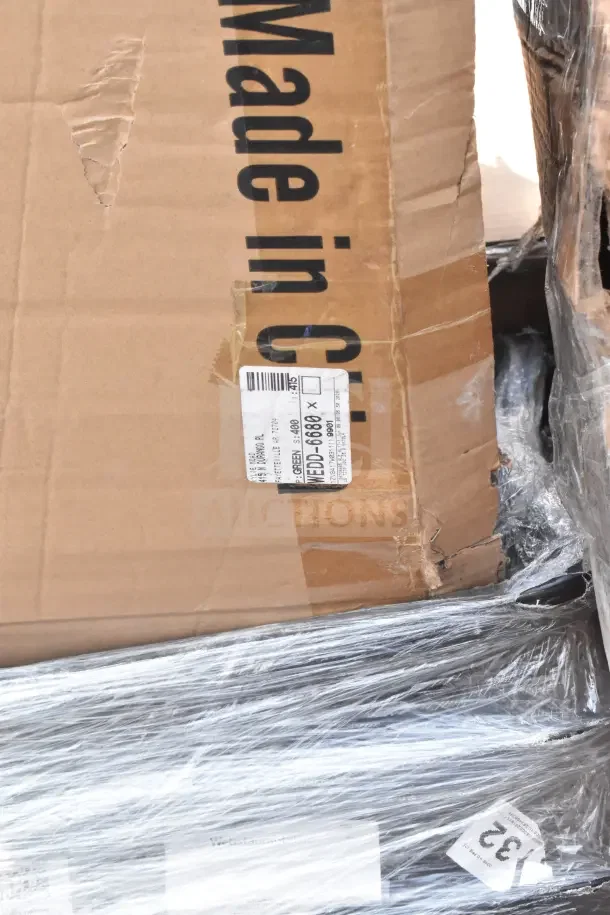 Cardboard box with shipping label, part of a 28-piece scratch and dent auction lot, includes a chair and hole punch.