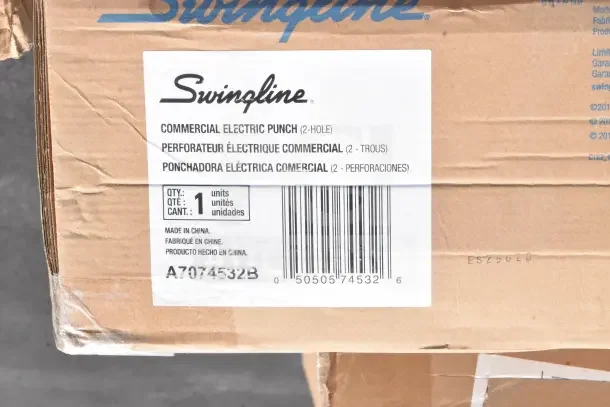Swingline commercial electric 2-hole punch box with label indicating quantity, made in China. Scratch and dent condition.