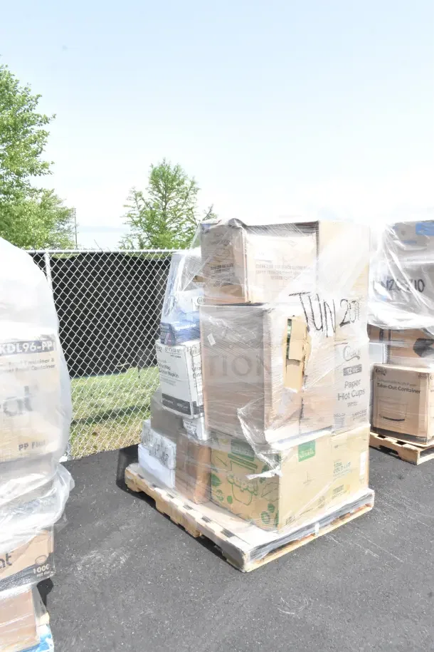 Pallet of assorted foodservice supplies including straws, film, hot dog bags, and cups. Boxes wrapped in plastic.