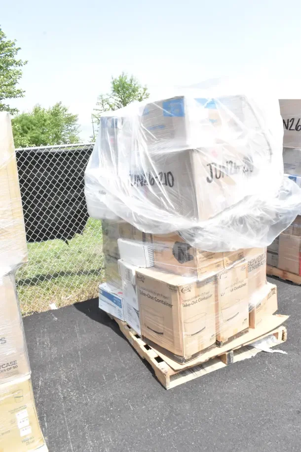Pallet of 25 brand new, scratch and dent items including plates, serving tongs, and containers, wrapped in plastic.