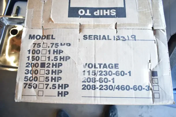 BRAND NEW SCRATCH AND DENT! Scotsman 720KUFM15 Floor Mount Kit in box. Serial 13319, model info, and voltage options visible.