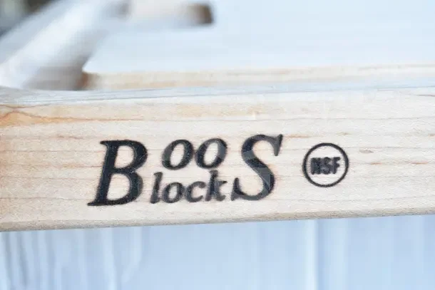 BRAND NEW John Boos cutting board with minor scratches. Features "Boos Block" logo and NSF marking. Durable and high-quality.